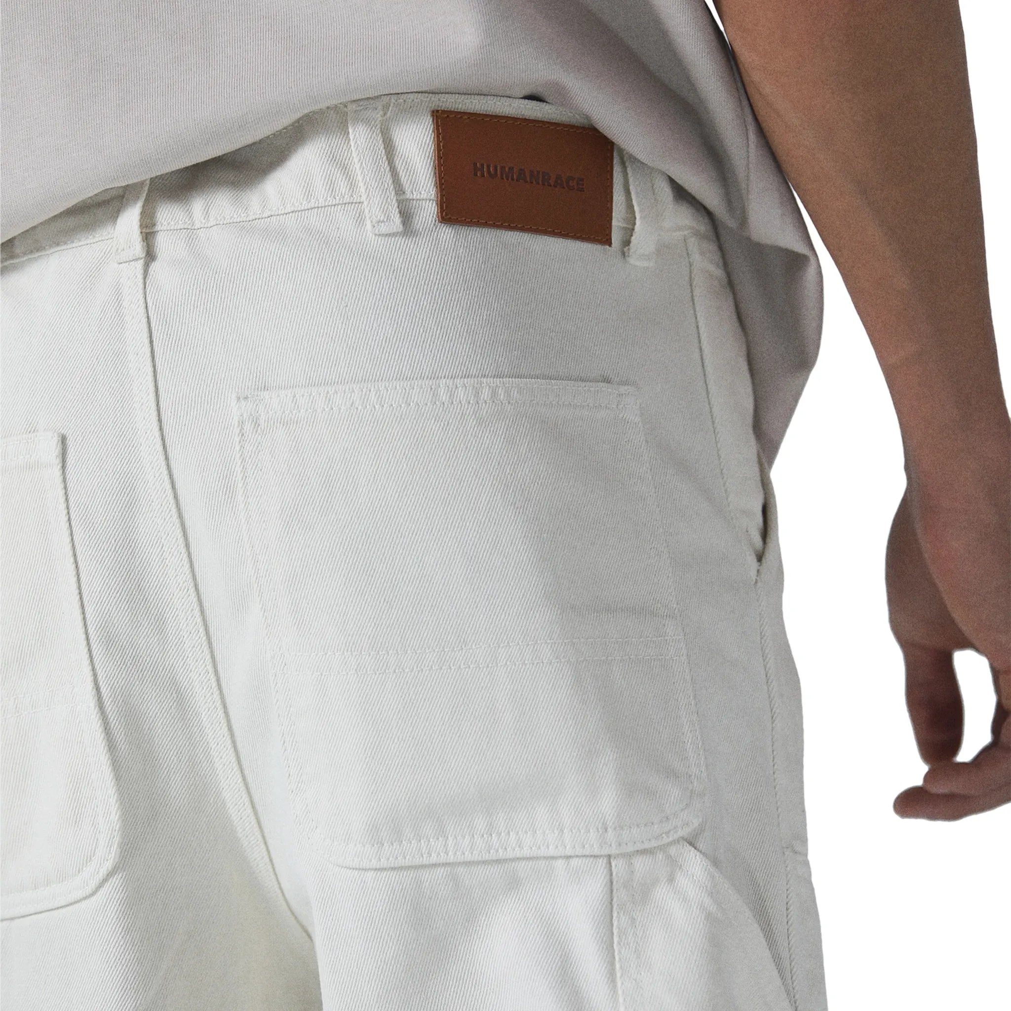 Model back detail view of Human Race Genetics Ecru Carpenter Jeans